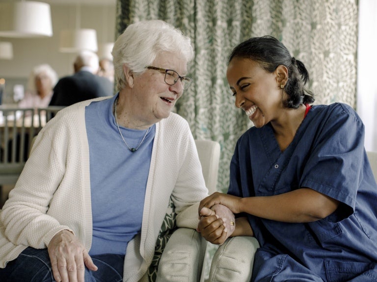 carehome-resident-and-worker-having-a-chat