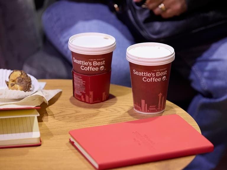 2 Seattle's Best Coffee cups on table