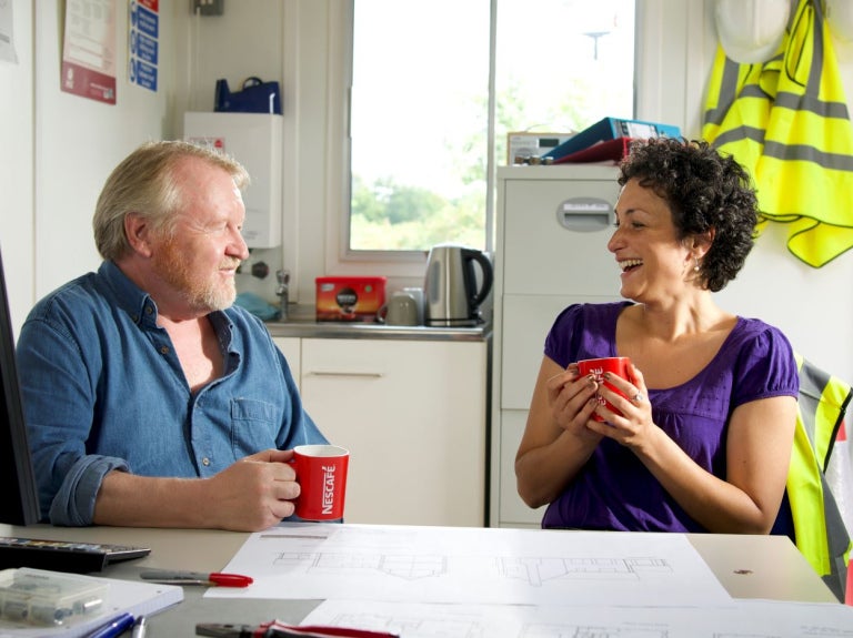 two people enjoying nescafe original in the workplace