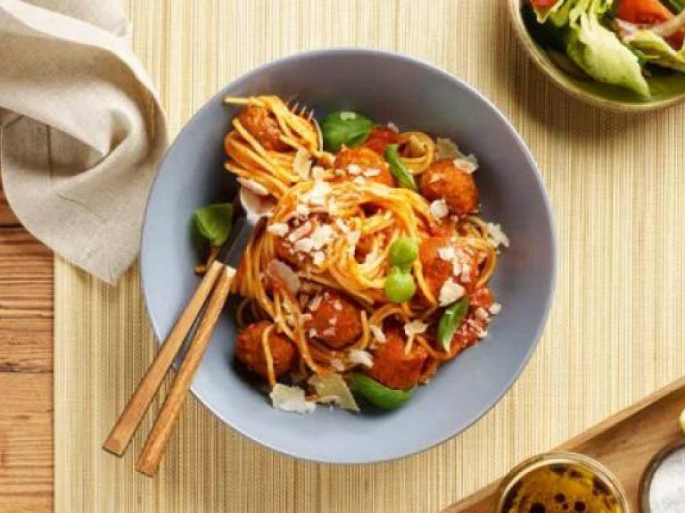 Vegan pasta arrabbiata in a bowl at a restaurant