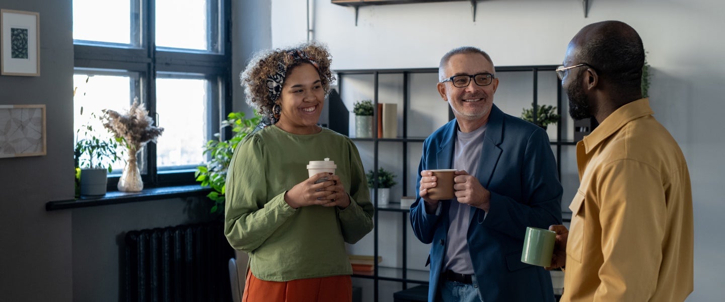 Employees enjoying a micro-break over coffee