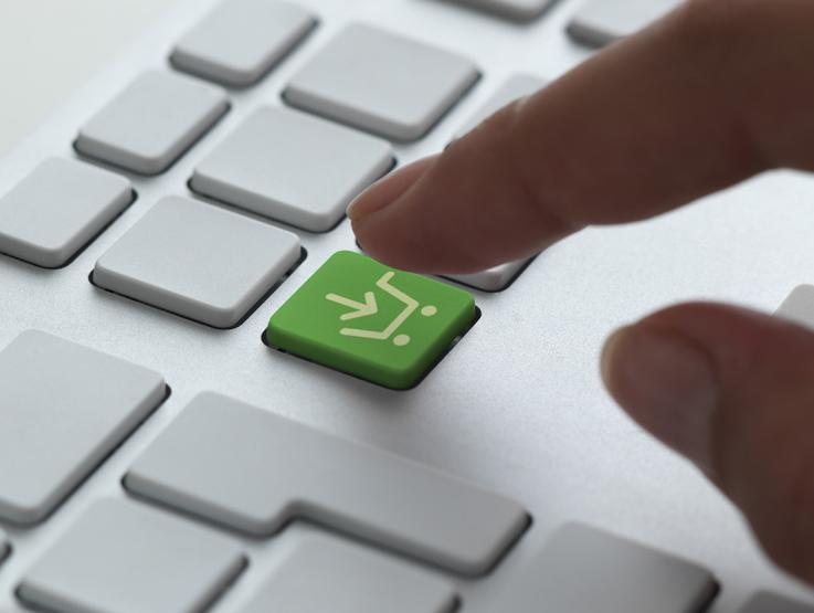 a close up of a keyboard with a shopping cart key