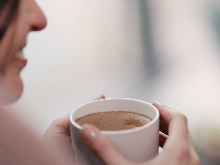person holding a cup of coffee