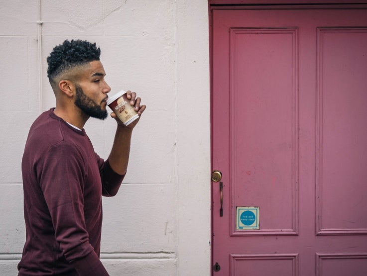 Man drinking Nescafe &amp;go
