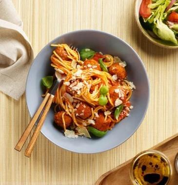 Vegan pasta arrabbiata in a bowl at a restaurant