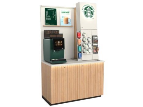 Starbucks self-serve coffee kiosk with espresso machine, syrup dispensers, cups, and promotional signage on a wooden cabinet 