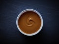 Carnation Dulce De leche in a small bowl