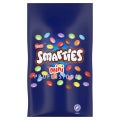 Nestlé Smarties Mini Professional chocolate candy in a blue bag with colorful candy pieces scattered on the front.