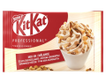 Nestlé KitKat Professional Mix-In package featuring a swirl of soft serve ice cream topped with crunchy KitKat pieces.
