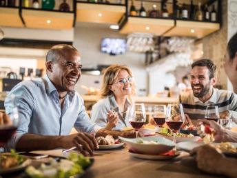 Friends laughing in a restaurant