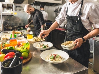 Chefs working in a dark kitchen