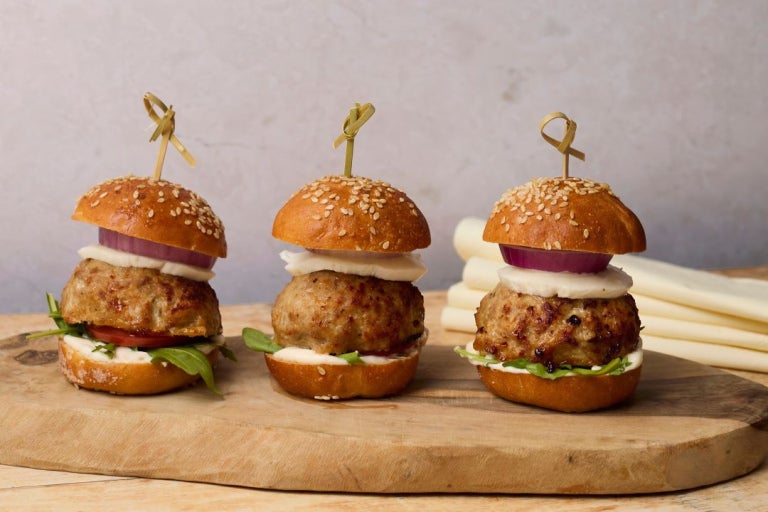 three truffle turkey meatball sliders plated with skewers
