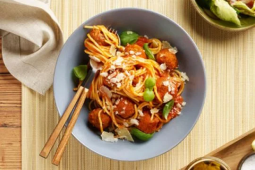 Vegan pasta arrabbiata in a bowl at a restaurant