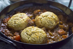 Beef and vegetable stew with mashed potato and parsley dumplings