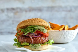 green burger served with watercress mayo