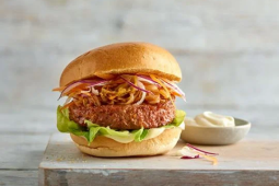 Korean burger on a wooden platter