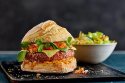 Mexican burger served on a black platter
