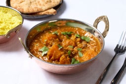mutton dhansak dish served with rice and naan
