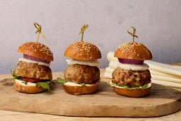 three truffle turkey meatball sliders plated with skewers