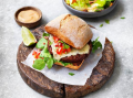 Mexican veggie burger served with salad