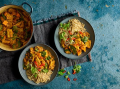 Two bowls of vegan african stew with rice