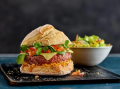 Mexican burger served on a black platter