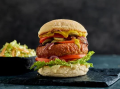 Vegan burger recipe with fries served on a black platter