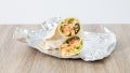 bang bang veggie wrap placed on foil on a table