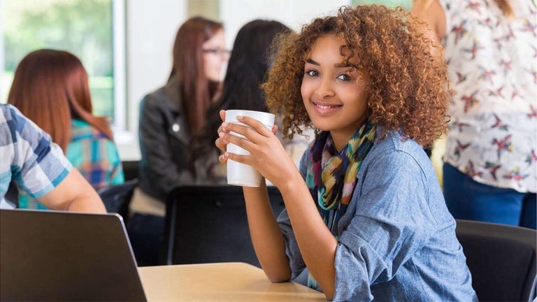 young woman drinking coffee from a cup