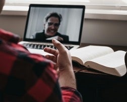 Two people having a remote meeting online